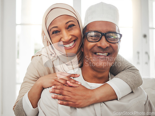 Image of Portrait, Muslim and elderly couple smile, hug and happy for support, trust and care in retirement, bonding or marriage. Face, home and Islamic man, woman and elderly people together for quality time