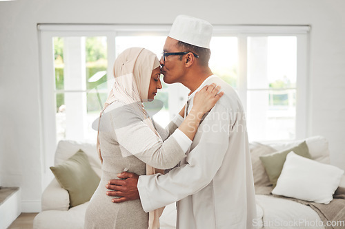 Image of Home, Muslim or senior couple kiss, slow dance and bond for love, trust and care in retirement, support or marriage. Romance, Islamic or Arab man, woman and elderly people together for quality time