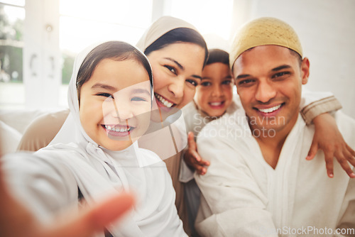 Image of Selfie, Islam and happy family in living room for Eid with mom, dad and kids with home culture in Indonesia. Muslim man, woman in hijab and children in portrait to celebrate Ramadan on sofa together.