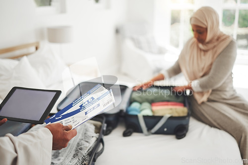 Image of Travel, ticket and Muslim couple with suitcase packing for holiday, vacation and religious trip. Home, luggage and man and woman with boarding pass in bedroom for journey, adventure and tourism