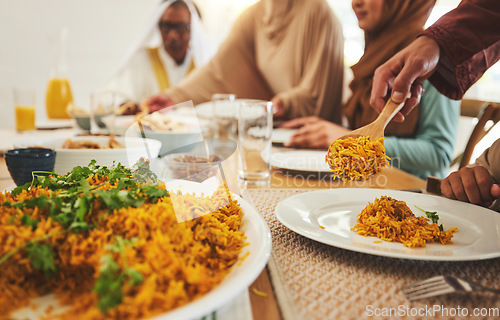 Image of Food, closeup and muslim with big family at table for eid mubarak, Islamic celebration and lunch. Ramadan festival, culture and iftar with people eating at home for fasting, islam or religion holiday