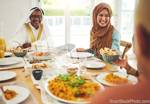 Image of Food, help and muslim with big family at table for eid mubarak, Islamic celebration and lunch. Ramadan festival, culture and iftar with people eating at home for fasting, islam and religion holiday