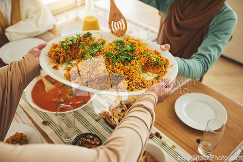 Image of Culture, Eid Mubarak and food for family at table for Islamic celebration, festival and lunch together. Ramadan, religion and above of hands with meal, dish and cuisine for fasting, holiday and feast