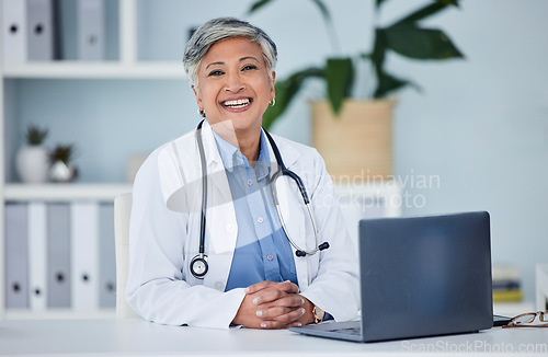 Image of Doctor, happy portrait and woman in office for medical consultation, support and services planning or advice. Face of healthcare worker or senior person on laptop of health insurance or online clinic