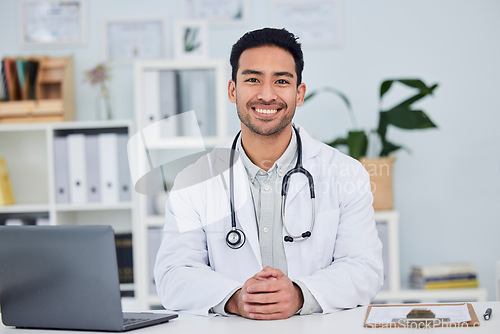Image of Doctor, portrait and man in healthcare office for consultation, support and services with management and insurance. Happy face of medical worker or asian person consulting in clinic or hospital