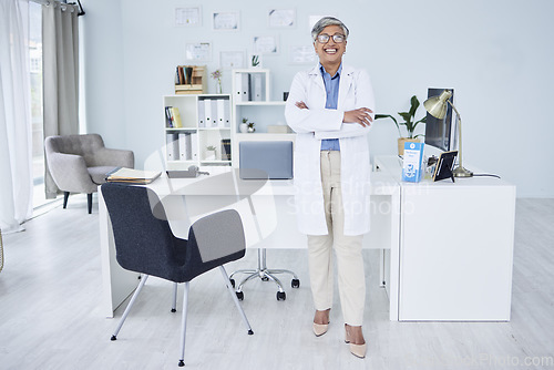 Image of Happy senior woman, doctor and arms crossed in confidence of healthcare consultant at the office. Portrait of confident and mature female person or medical professional ready for health consultation