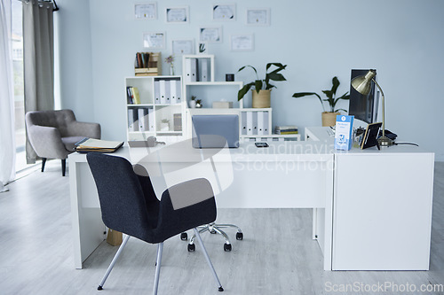 Image of Empty, office of medical doctor and consultation with furniture, table or professional layout of hospital interior. Background, consulting room or workplace in healthcare, surgery and wellness clinic