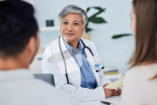Image of Senior woman, doctor and couple in consultation for healthcare advice or life insurance at hospital. Happy mature female person or medical professional in meeting, discussion or consulting patients