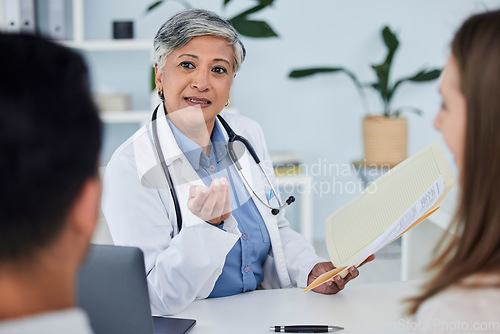 Image of Senior woman, doctor and couple for life insurance, consultation or healthcare advice at the hospital. Happy mature female person or medical professional in meeting, discussion or consulting patients