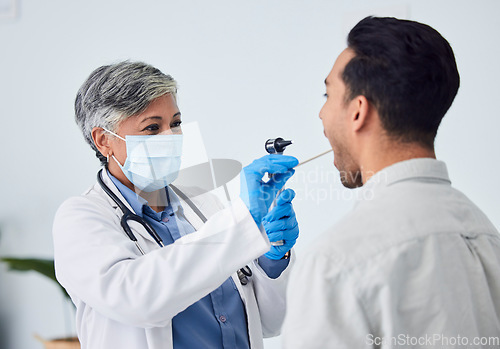 Image of Woman, doctor and face mask with patient for checkup, exam or healthcare appointment at the hospital. Female person or medical professional with protection checking ill or sick man with flu at clinic