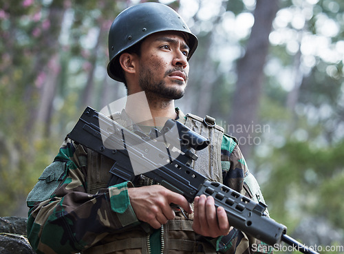 Image of Veteran, army and man with gun for forest training, outdoor shooting range and military mission, search and focus. Rifle, soldier or young person in woods or nature with battlefield gear and vision