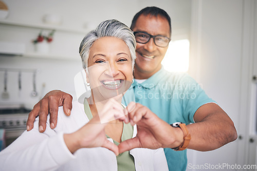 Image of Heart hands, love and smile with portrait of old couple for support, happy and relax. Happiness, kindness and peace with senior man and woman and gesture at home for embrace, trust and retirement