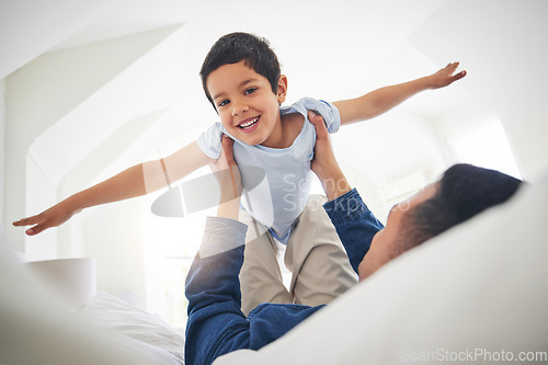 Image of Airplane, portrait and boy child with father on a bed with love, bonding and having fun with game at home. Flying, playing and face of kid smile with parent in a bedroom with fantasy, plane or lift