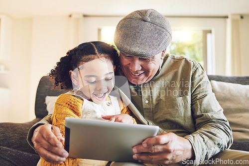 Image of Young girl, grandfather and tablet, relax together and watch cartoon or e learning with games while at home. Bonding, love and spending quality time, old man and female child with gadget and internet