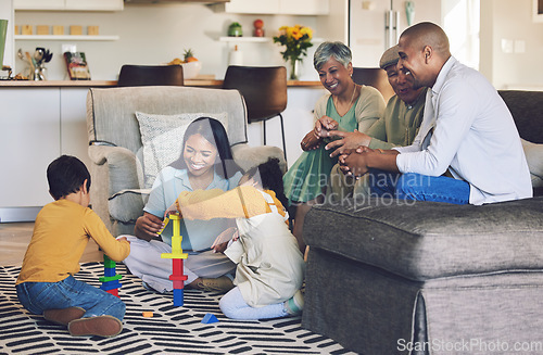 Image of Big family, parents or happy kids on floor with toys for playing, creative fun or bonding at home. Development, smile or children enjoy building blocks games to relax with mom, dad or grandparents