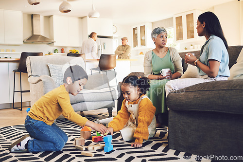 Image of Family home, kids and siblings with toys, living room and play on floor with grandparents, parents or games. Men, women and children for building blocks, development and learning in lounge in house