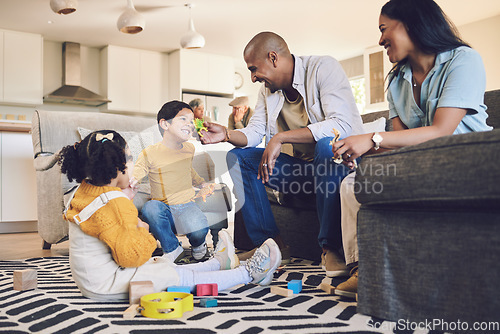 Image of Family home, kids and parents with toys, living room and playful on floor with talking, laughing and games. Men, women and children with building blocks, development and learning in lounge in house