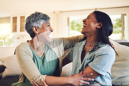 Image of Funny, senior mother and hug daughter in home, bonding and laughing together. Happy, elderly mom and embrace woman, relax and smile with care, love and enjoying time on living room sofa with family.