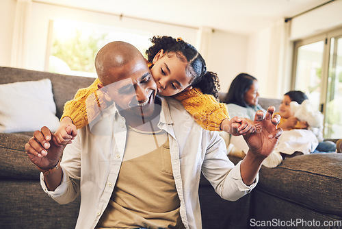 Image of Happy, playing and a child with a kiss for a father, love and bonding together in a house. Smile, family and a girl and a young dad holding hands with a piggyback in the living room for a hug