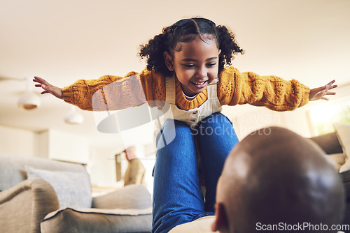 Image of Young girl, father and playing, airplane and flying with freedom, bonding and happiness at home. People in living room, family house and relax, care free and playful with games, fun and man with kid