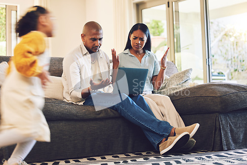 Image of Child running with stressed parents on a laptop at their home in the living room with problems. Upset, technology and girl kid moving fast with blur motion with mother and father on computer on sofa.