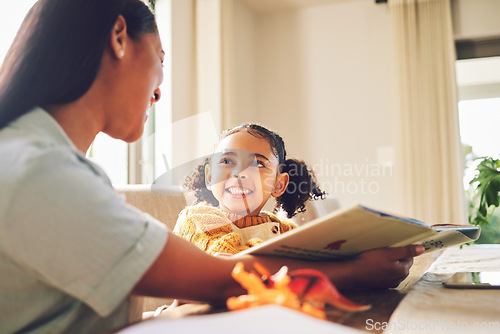 Image of Story, help and mother with a child for reading, teaching and support with homework. Family, house and a mom and girl kid learning knowledge from a book and studying together for homeschool education