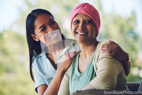 Image of Happy, smile and woman with her mother with cancer sitting, bonding and spending time together. Sweet, love and portrait of sick mature female person embracing her adult daughter in an outdoor garden