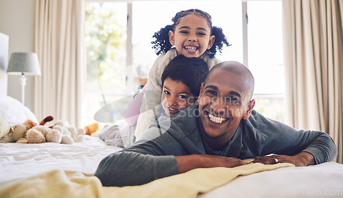 Image of Bed, playful and portrait of a father with children for love, care or bonding in the morning. Happy, family and a young dad with kids in the bedroom of a house for quality time and playing together