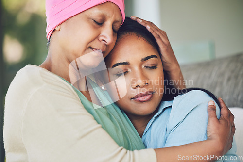 Image of Family, old woman hugging her daughter and love with people sitting on a sofa in the home living room during a visit. Smile, trust or comfort with a mature female parent embracing an adult child
