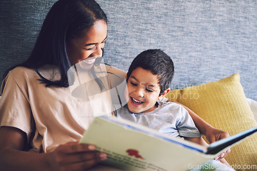 Image of Family home, mother and child reading a book in a bed together with love, care and security or comfort. Woman and kid with a happy smile and quality time for learning or story in bedroom to relax