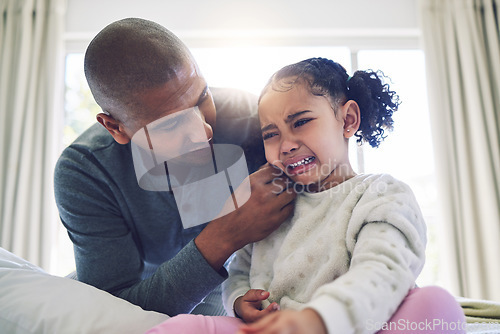 Image of Father, crying girl kid and comfort with talk, care and support with love, bonding and help in family home. Dad, sad daughter and empathy with chat to deal with emotions, fear and anxiety in house