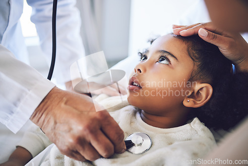 Image of Hands, stethoscope and doctor with child for heart healthcare, breathing or check lungs for wellness in hospital. Girl, medical professional or pediatrician with cardiology instrument in consultation