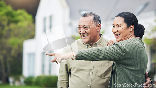 Image of Happy, pointing and a senior couple in nature for a holiday, travel or break in retirement. Smile, love and an elderly man and woman with a gesture in a backyard or neighborhood lawn for the view