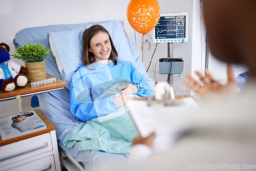 Image of Healthcare, woman and patient with recovery, smile and consultation with good news, help and treatment. Female person, doctor and lady in a hospital bed, healing and diagnosis with procedure success