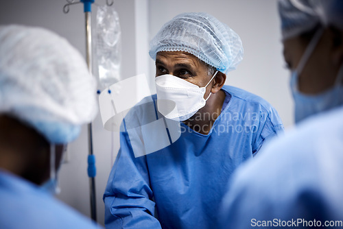 Image of Surgery, surgeon or doctors with mask for emergency, accident or healthcare in hospital clinic. People, medical or nurses in surgical collaboration helping in operating room with teamwork or support