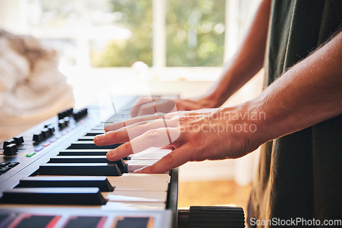 Image of Piano, man and hands on keys for music, creative talent and skills in home studio. Closeup, musician and playing synthesizer keyboard for audio performance, sound artist and learning instrument notes