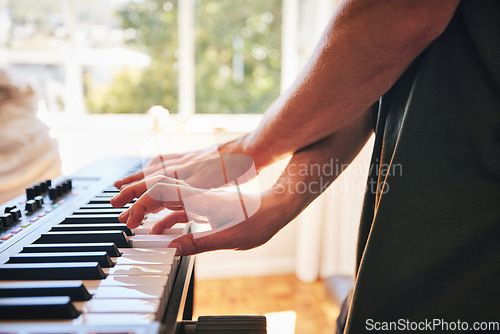 Image of Hands, man and piano keyboard for talent, skills and creativity of band in home studio. Closeup, musician and fingers playing electrical instrument in audio performance, sound artist or entertainment