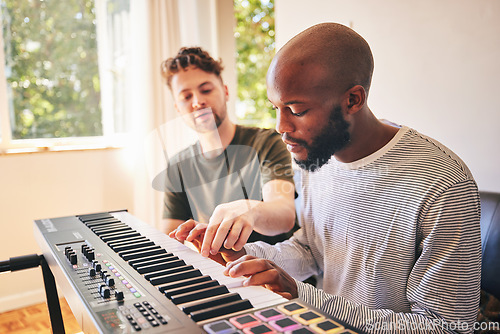 Image of Music, piano and teacher with black man, learning or practice together in home. Electric keyboard, playing and people training for creative production of sound, audio and coaching instructor in house