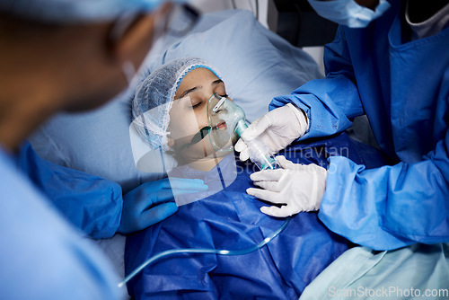 Image of Doctor, hospital bed or sick woman with an oxygen mask, respiratory or operation for healthcare recovery. Medical surgeon, anesthesia or patient with breathing equipment for ventilation in emergency