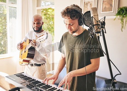 Image of Piano, recording music and friends with guitar in home studio together. Electric keyboard, instrument and microphone of singer in collaboration for acoustic production with headphones of creative men