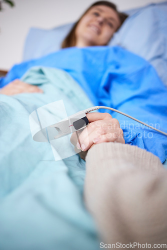 Image of Holding hands, support and woman in hospital for cancer, sick or surgery. Comfort, care and person together with patient for hope, empathy or kindness, health and faith to help with medical healing.