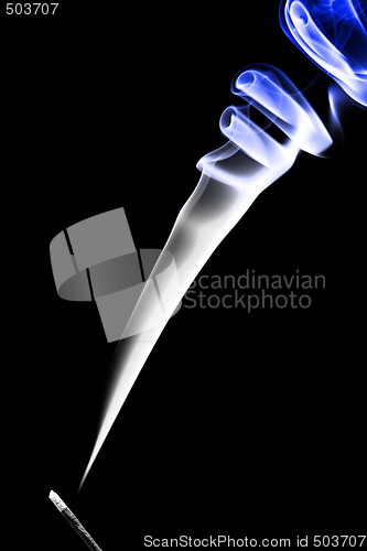 Image of Stick with a blue smoke. Isolated on a black background