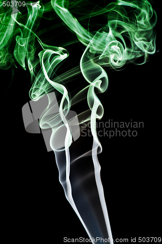 Image of Abstract green smoke. Isolated on a black background