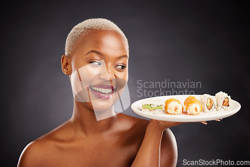 Image of Happy, black woman and plate of sushi with salmon, rice and vegetables for eating a platter of fish, seafood or luxury. Healthy menu, diet or lunch and dinner of sashimi from Asian restaurant