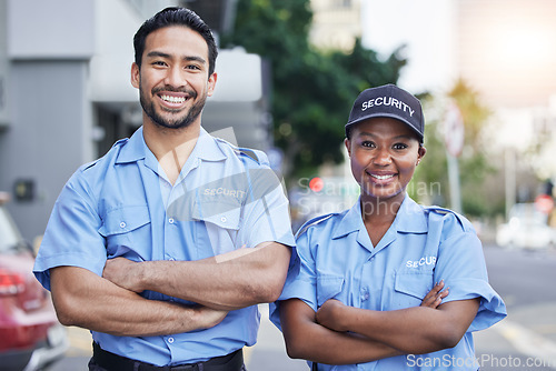 Image of Woman, man and security guard portrait in city, arms crossed and happy for support, safety and teamwork. Protection agent, smile and face with partnership, solidarity or pride for job in metro street