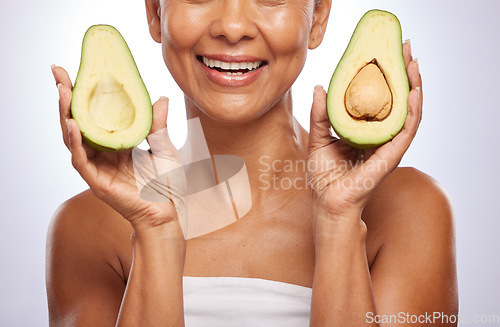 Image of Avocado, skincare or happy woman with fruit for a healthy diet, detox or vitamins with beauty in studio. Wellness, hands closeup or face of model smiling in dermatology treatment on white background