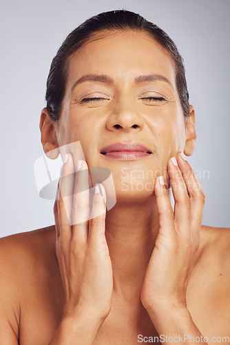 Image of Cosmetics, dermatology and woman with skincare, makeup and grooming against a studio background. Female person, aesthetic and model with luxury treatment, natural beauty and self care with a glow