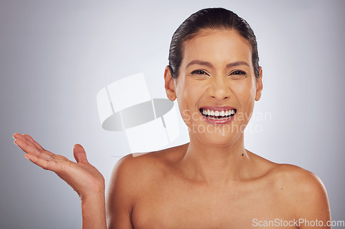 Image of Portrait, showing and woman with skincare, cosmetics and dermatology against a grey studio background. Face detox, female person or model with happiness, natural beauty or mockup space with self care