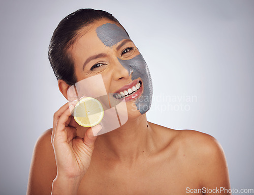 Image of Woman, skincare, with lemon and face mask with charcoal, clay or natural beauty product for wellness, detox or nutrition. Fruit, vitamin c and girl with healthy cosmetics or vegan facial care