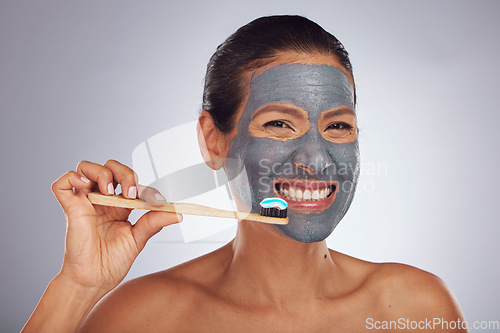 Image of Woman, brushing teeth and skincare portrait for dental, eco friendly product and charcoal face mask. Beauty, bamboo toothbrush and person or model facial and mouth cleaning on studio white background